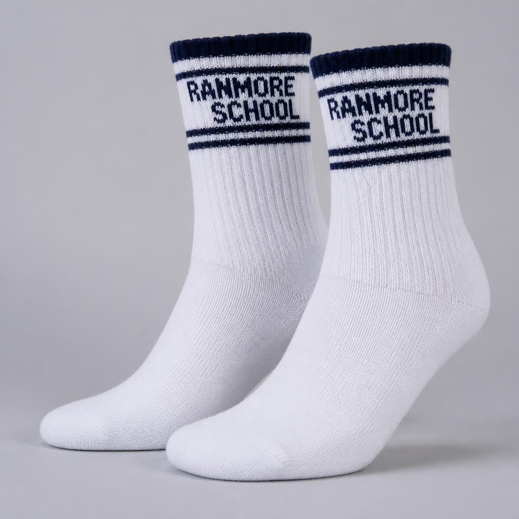 White knitted school crew socks with a navy band and knitted school name